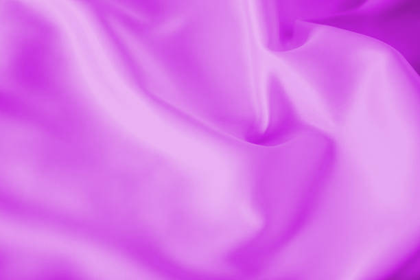 istock Smooth elegant shiny magenta silk or satin luxury cloth texture can use as abstract holidays background. Luxurious Christmas background or New Year background design. 1056853542
