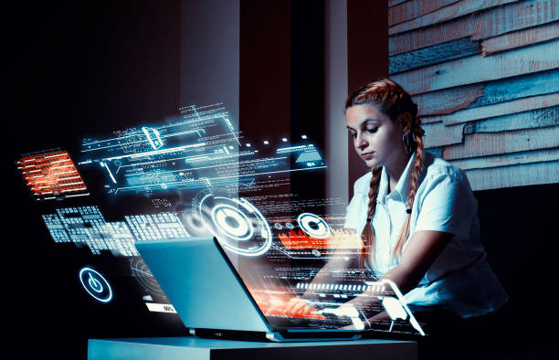 istock Young woman working on laptop at home.Futuristic user interface. 1056853742