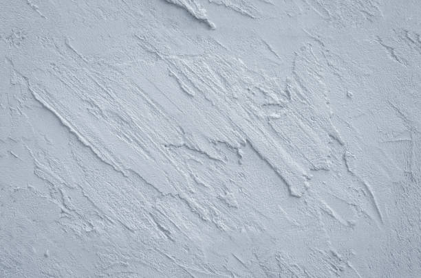 istock gray concrete wall background texture clean stucco fine grain cement high relief Sculpture. 1056855156