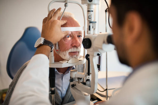 istock Old men having an eye exam at ophthalmologist's office. 1056857146