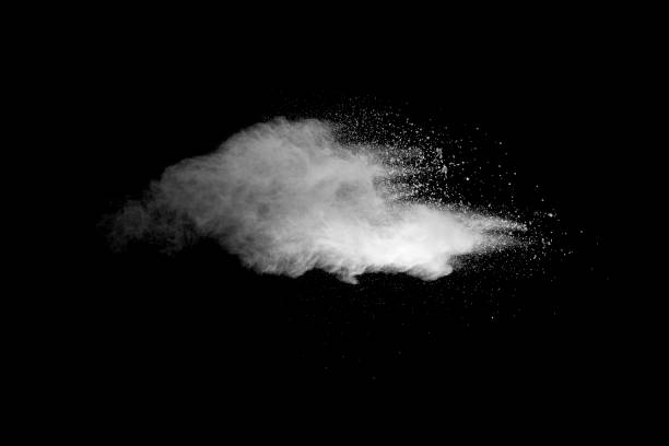 istock Explosion of white dust on black background. 1056861806
