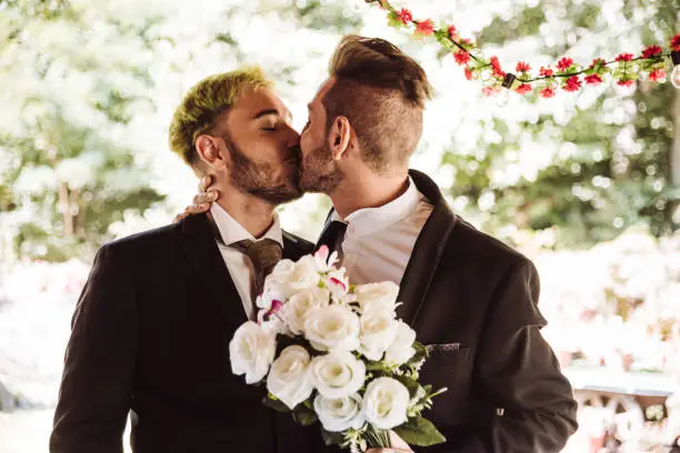 gay couple kissing for the marriage