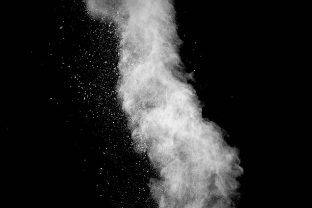 istock Explosion of white dust on black background. 1056861940