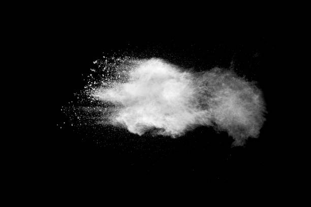 istock Explosion of white dust on black background. 1056862214