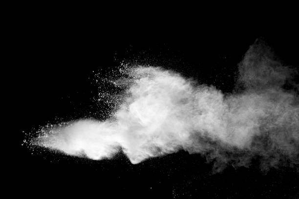 istock Explosion of white dust on black background. 1056862238