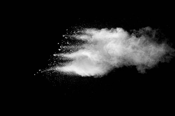 istock Explosion of white dust on black background. 1056862294