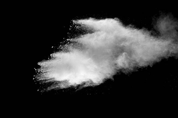 istock Explosion of white dust on black background. 1056862322