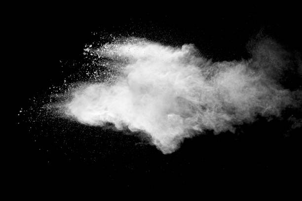 istock Explosion of white dust on black background. 1056862442