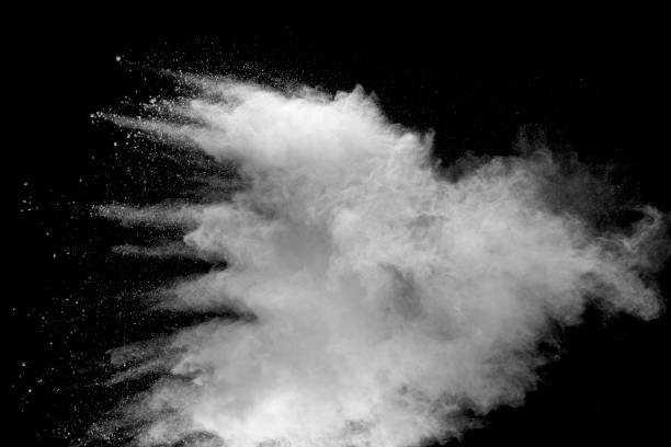 istock Explosion of white dust on black background. 1056862480