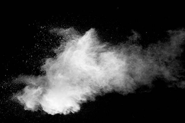 istock Explosion of white dust on black background. 1056862484
