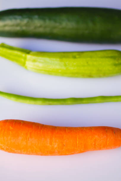 fresh green kidney bean pod, carrot, cumber and zucchini isolated on white background. fresh vegetables concept - green bean bean pod nobody imagens e fotografias de stock
