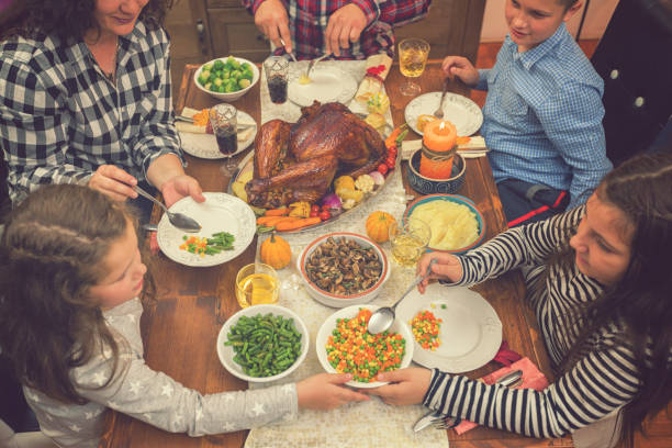 istock Family Celebrating Thanksgiving Day at Home 1056864700