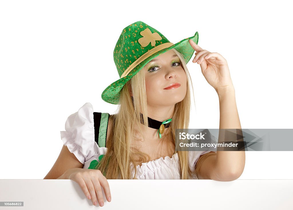 St. Patrick's Day girl St. Patrick's Day young woman dressed in Irish clothing holding a blank sign. Adult Stock Photo