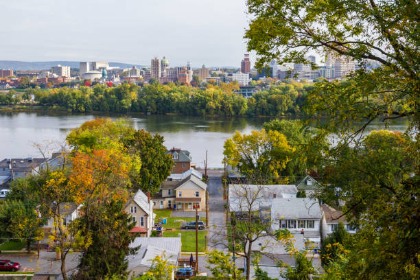 High Angle View Of A Quaint River Town In Autumn, Harrisburg Pennsylvania In Background stock photo
