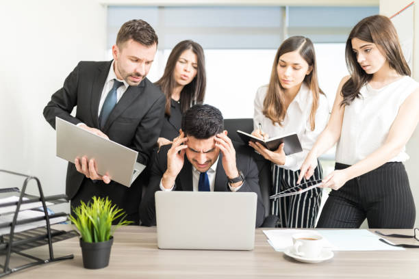 Male Business Executive Missing Deadline At Desk