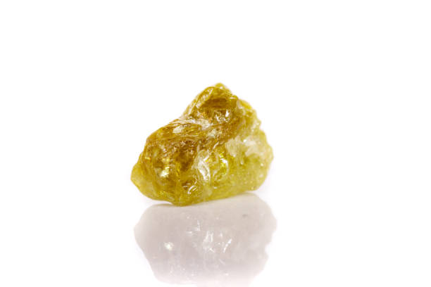 istock Macro mineral stone Green pomegranate on white background 1056872634