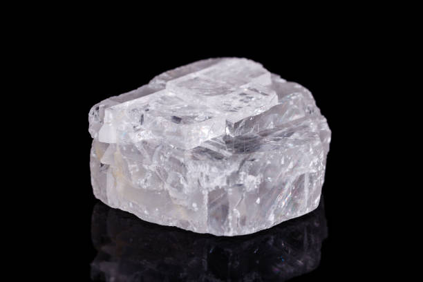 istock Macro mineral stone Iceland spar on black background 1056872810