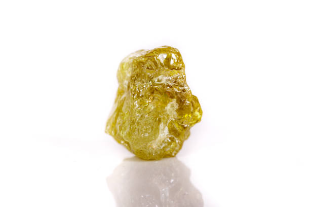 istock Macro mineral stone Green pomegranate on white background 1056874058