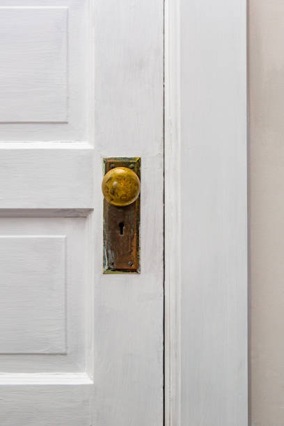 istock Antique door and door knob, close up 1056874236