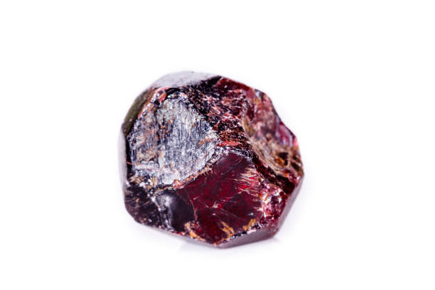 istock Macro of a mineral garnet stone on a white background 1056874238