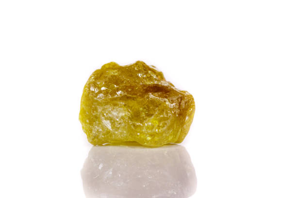 istock Macro mineral stone Green pomegranate on white background 1056874246