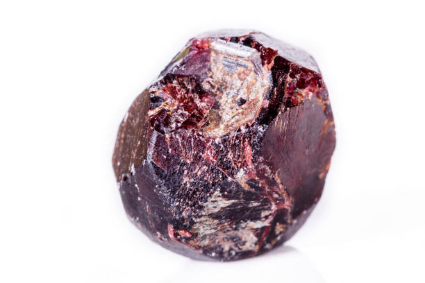 istock Macro of a mineral garnet stone on a white background 1056874558