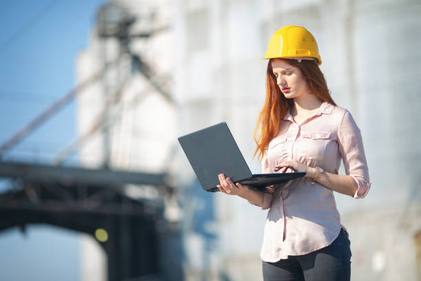 istock Young manager in front of silo 1056874624