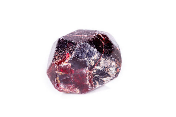 istock Macro of a mineral garnet stone on a white background 1056874656