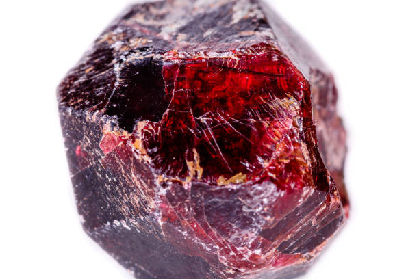 istock Macro of a mineral garnet stone on a white background 1056874672