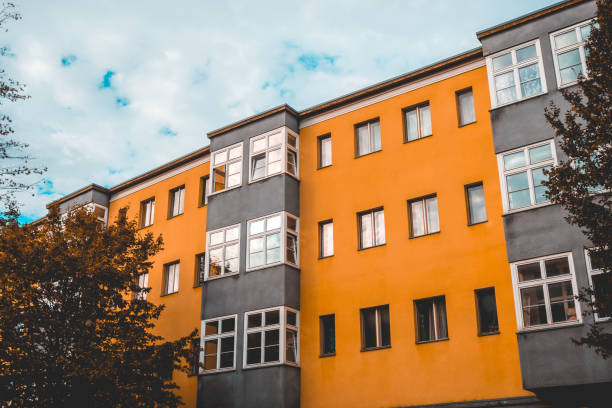 istock orange and grey colored building in gdr style at germany 1056874738