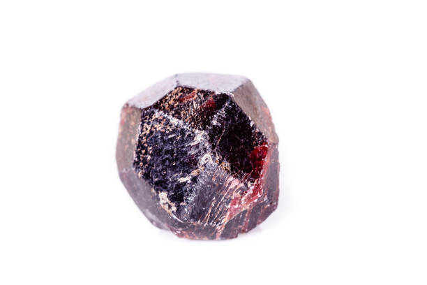 istock Macro of a mineral garnet stone on a white background 1056875006