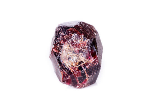istock Macro of a mineral garnet stone on a white background 1056875080