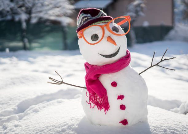 Snowman on snow background stock photo