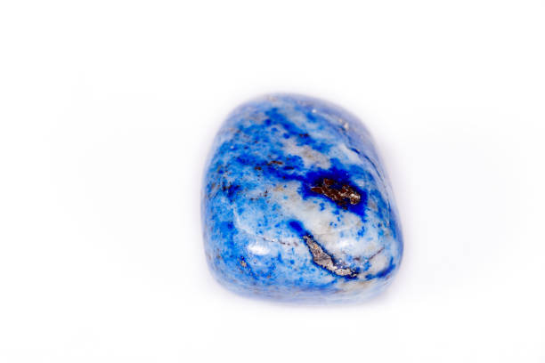 istock Macro mineral stone blue lapis lazuli (afghanistan) on white background 1056881582