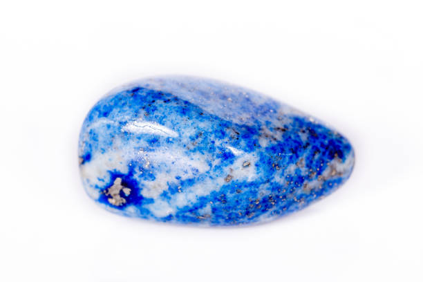 istock Macro mineral stone blue lapis lazuli (afghanistan) on white background 1056882046