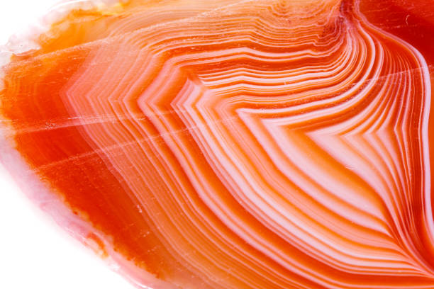 istock Macro mineral orange agate in crystals on white background 1056882434