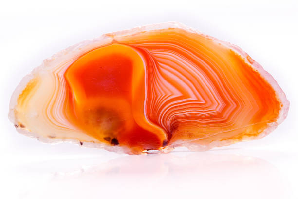 istock Macro mineral orange agate in crystals on white background 1056882728