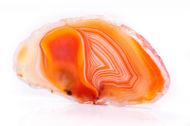 istock Macro mineral orange agate in crystals on white background 1056882922
