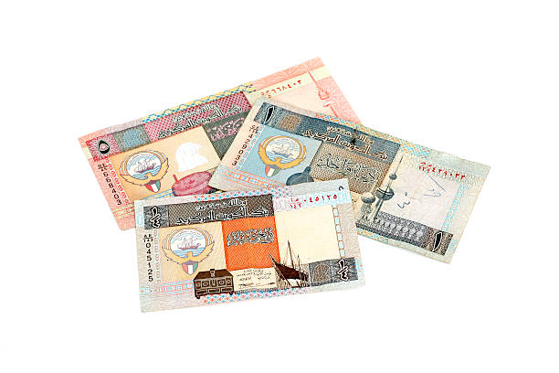 Kuwaiti Money Kuwaiti Dinar Bills on white background. Arabic writing and numberals, 1/4, 1 and 5 dinar bills. dinar stock pictures, royalty-free photos & images