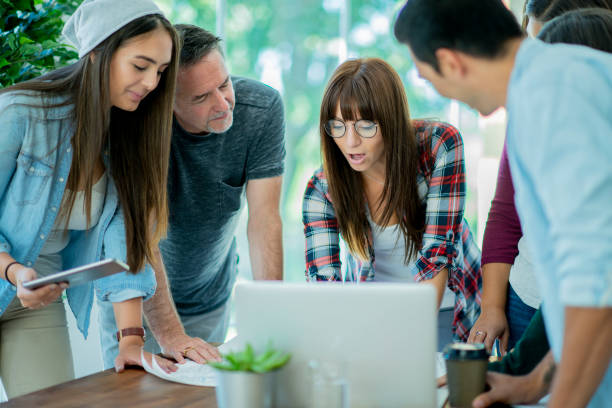 istock Female professional meets with her colleagues 1056886296
