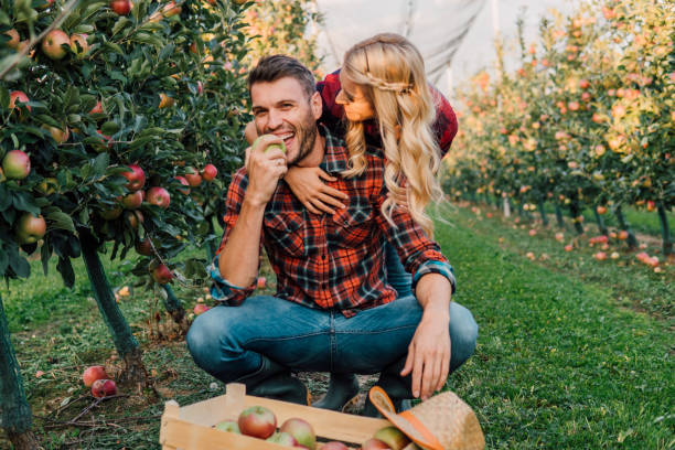 istock Farmer eating an apple outdoors 1056888864