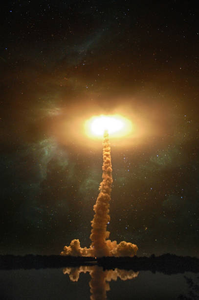 istock Spaceship launch at night, landscape with colorful smoke clouds and galaxy background collage. Light flash explosion portal. Elements of this image furnished by NASA. 1056893268