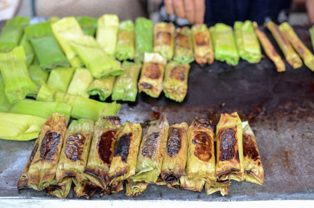 istock Pulot, Grilled sticky rice filled with banana leaves 1056895086