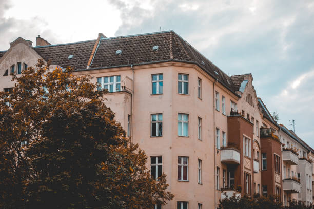 istock corner building with darken tree and highlighted sky 1056896664