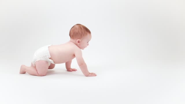 Happy baby learning to crawl