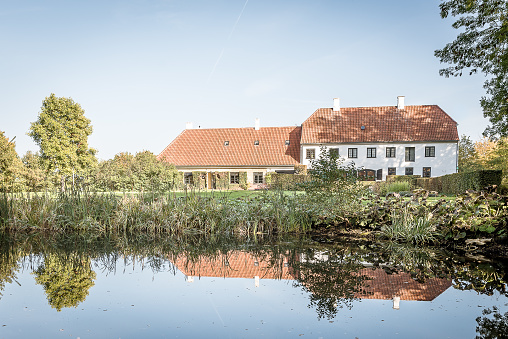 Rungstedlund, the home of the danish writer and storyteller Karen Blixen, reflections in the pund, Rungsted, Denmark, october 10, 2018