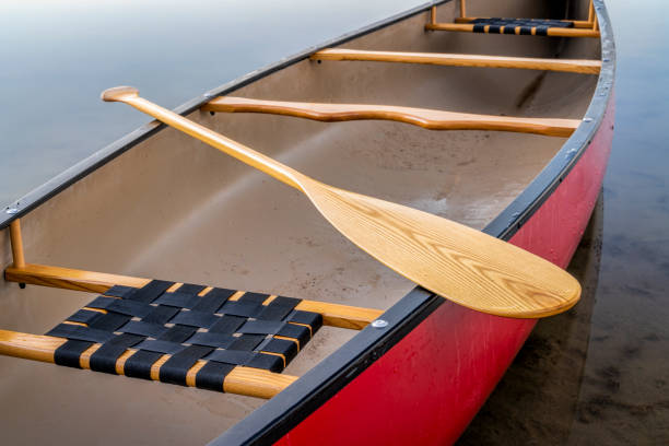 istock red canoe on a calm lake 1056905416