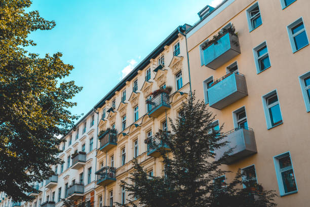 istock orange apartment buildings with trees in the foreground 1056905872