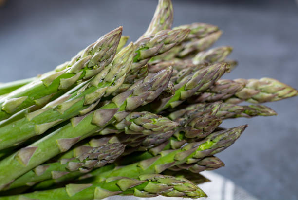 istock Fresh green uncooked asparagus, healtry vegetables 1056906418
