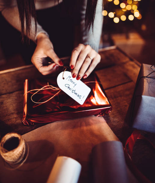 istock woman making the package for the christmas gift 1056906590
